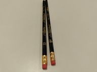 Ceruza, fekete alapon, aranyszínű trombitával